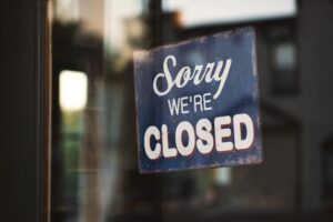 Picture of a sign, which reads "Sorry We're Closed."
