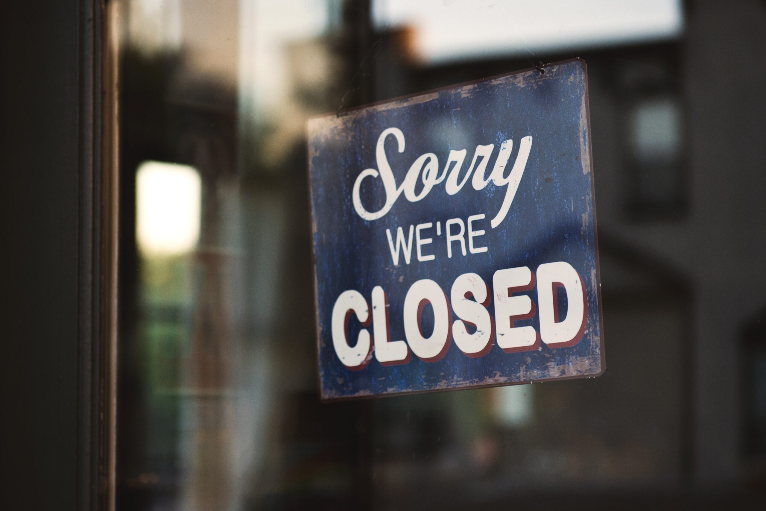 Picture of a sign, which reads Sorry We're Closed.